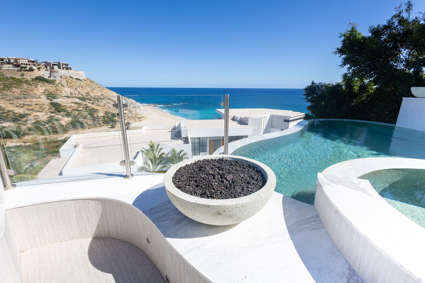 Villa living space opening to an ocean-view terrace